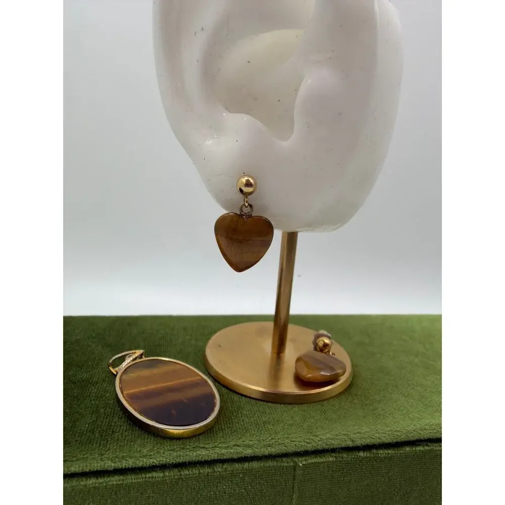 set features heart-shaped Tiger's Eye stones set in gold-tone metal